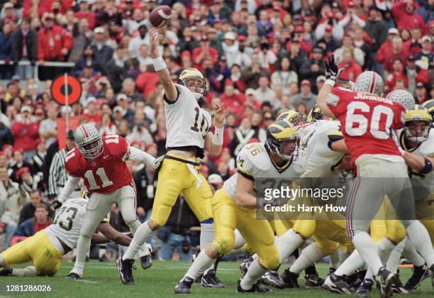 Tom Brady Quarterback for the University of Michigan Wolverines throws a pass downfield during the NCAA Big Ten Conference college football game...