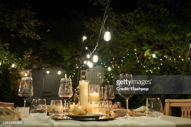 still life of a dressed dining table set for six people - candle light dinner stock pictures, royalty-free photos & images