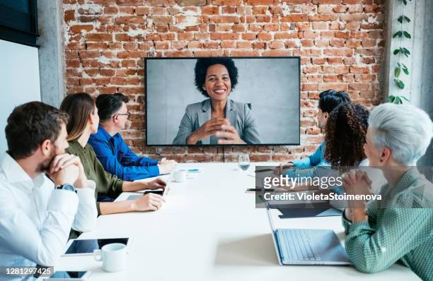business people in video conference. - board room stock pictures, royalty-free photos & images