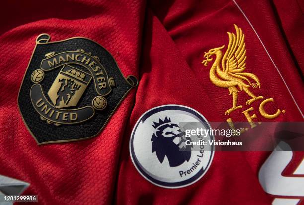 The Manchester United and Liverpool club badges with the Premier League logo on October 20, 2020 in Manchester, United Kingdom.
