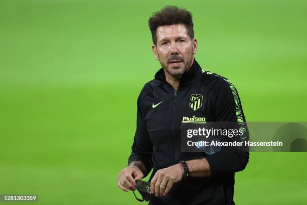Diego Simeone, head coach of Atletico looks on during a final training session ahead of the UEFA Champions League Group A stage match between...