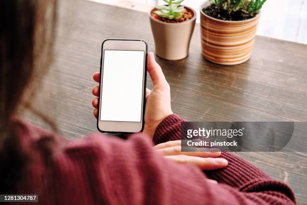 woman using smart phone. human hand and smart phone close-up shooting. - smartphone stock pictures, royalty-free photos & images