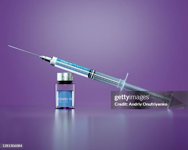 covid-19 vaccine - syringe stock-fotos und bilder