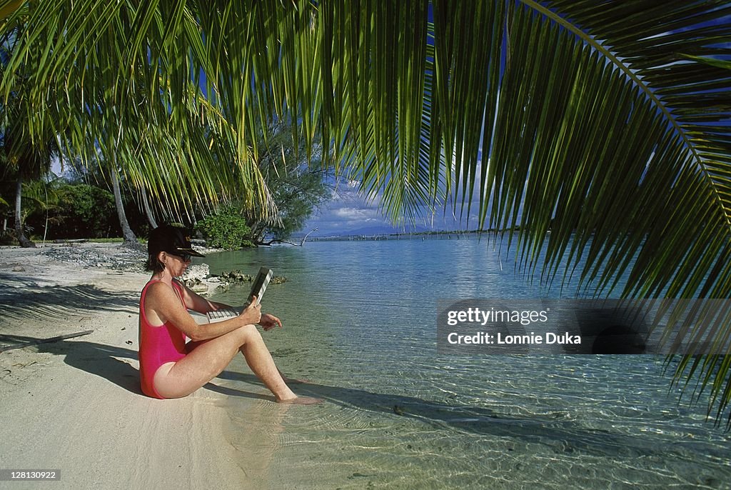 Woman w/laptop computer in Bora Bora