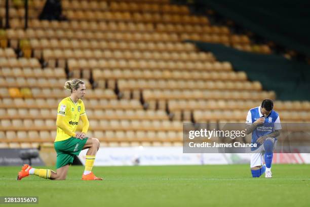 Todd Cantwell of Norwich City and Ivan Sanchez of Birmingham City takes a knee in support of the Black Lives Matter movement prior to during the Sky...