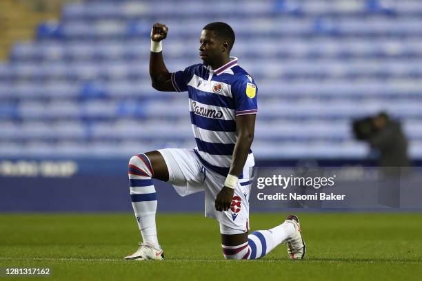 Lucas Joao of Reading takes a knee in support of the Black Lives Matter movement prior to the Sky Bet Championship match between Reading and Wycombe...