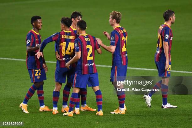 Ansu Fati of FC Barcelona celebrates with teammates after scoring his sides second goal during the UEFA Champions League Group G stage match between...