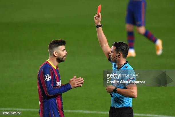Gerard Pique of FC Barcelona is shown a red card during the UEFA Champions League Group G stage match between FC Barcelona and Ferencvaros Budapest...