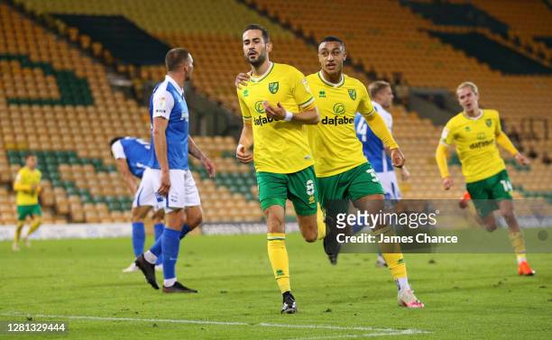 Mario Vrancic of Norwich City celebrates with Adam Idah after scoring his team's first goal during the Sky Bet Championship match between Norwich...