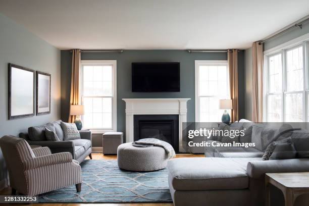 interior of clean and bright modern living room - ottomane fotografías e imágenes de stock