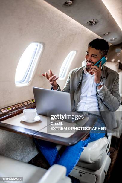 young businessman having a casual business trip - extreme wealth stock pictures, royalty-free photos & images