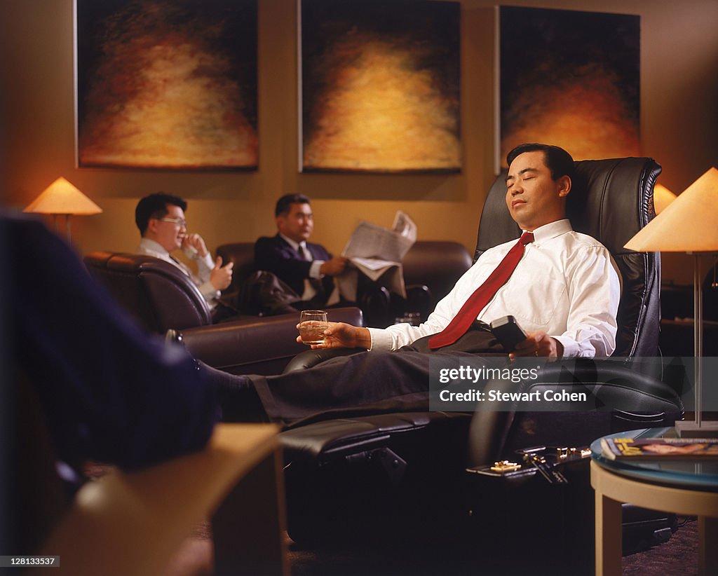 Businessman in airport lounge