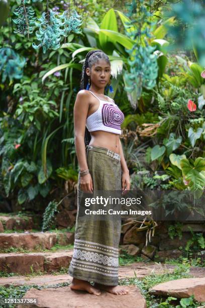 young afro colombian woman in garden - cali morales stock pictures, royalty-free photos & images