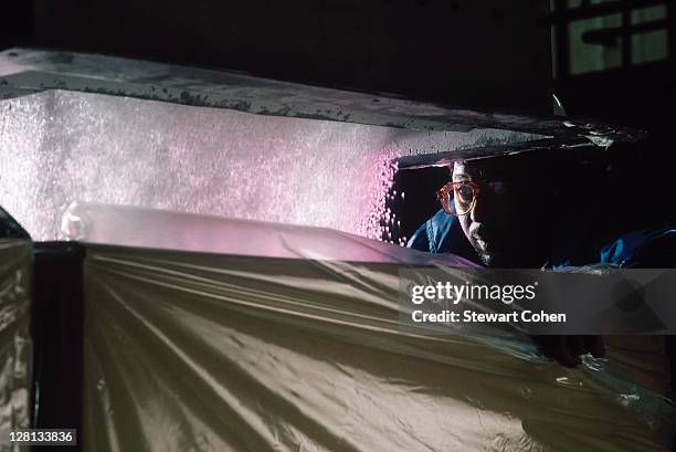 worker w/polypropylene beads - 合成樹脂 ストックフォトと画像