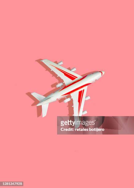 toy planes on pink background - model aeroplane stock pictures, royalty-free photos & images