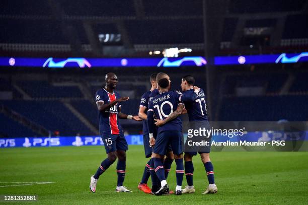 Neymar Jr of Paris Saint-Germain is congratulated by teammates after an own goal of Anthony Martial of Manchester United following his corner kick...