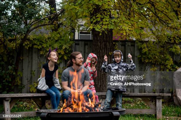 5yo story teller - fire pit stock pictures, royalty-free photos & images