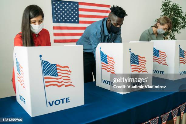 voting in the usa - voting mask stock pictures, royalty-free photos & images