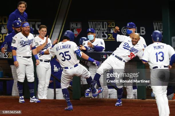Cody Bellinger of the Los Angeles Dodgers is congratulated by Mookie Betts after hitting a two run home run against the Tampa Bay Rays during the...