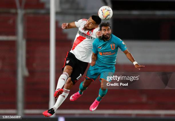 Nicolas De La Cruz of River Plate jumps for a header with Junior Sornoza of LDU during a Group D match of Copa CONMEBOL Libertadores 2020 between...