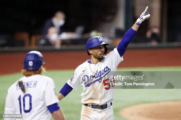 Mookie Betts of the Los Angeles Dodgers celebrates after hitting a solo home run against the Tampa Bay Rays during the sixth inning in Game One of...