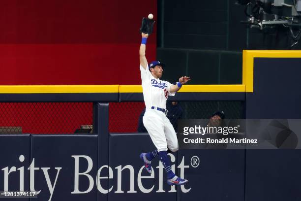 Cody Bellinger of the Los Angeles Dodgers catches a fly ball on a hit by Austin Meadows of the Tampa Bay Rays during the ninth inning in Game One of...