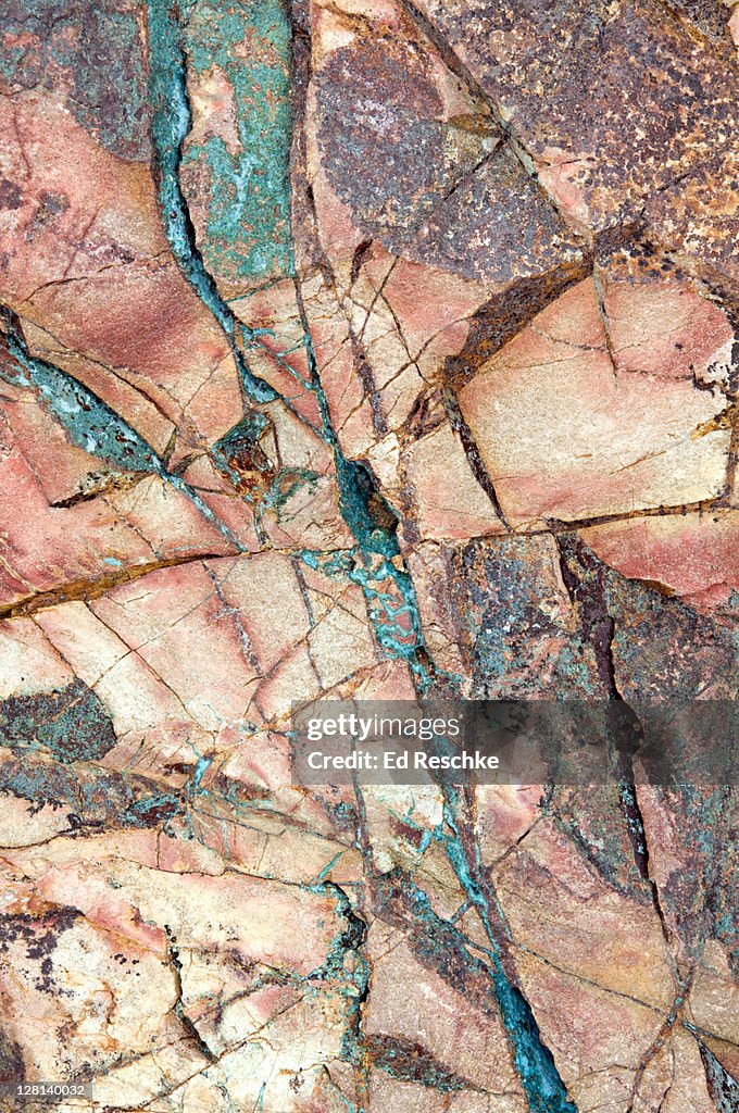 Copper Ore from Arizona. This is part of a boulder that was mined south of Tucson. It is rich in copper minerals. The blue-green is chrysocolla, the blue is azurite, and the green is malachite. USA