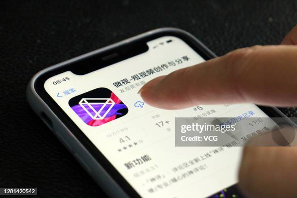 Tencent Weishi, a short video app, is displayed on the screen of a mobile phone on October 21, 2020 in Yichang, Hubei Province of China.