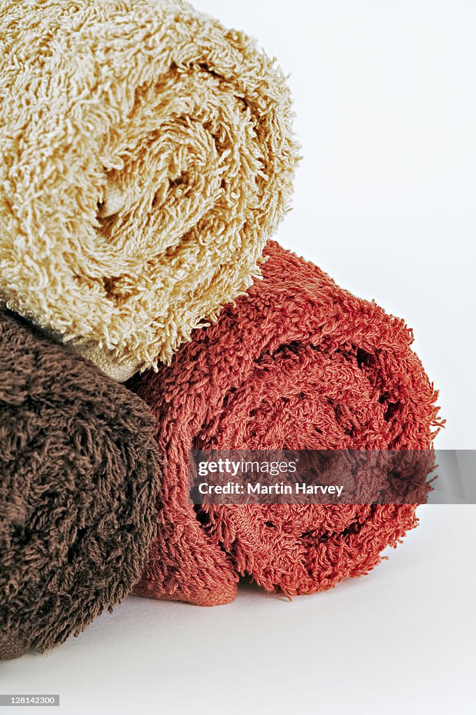 Studio shot of rolled-up towels against white background