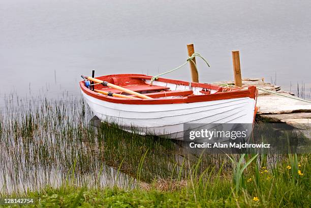 small wooden boat docked. orkney islands, scotland - 2r2f stock pictures, royalty-free photos & images