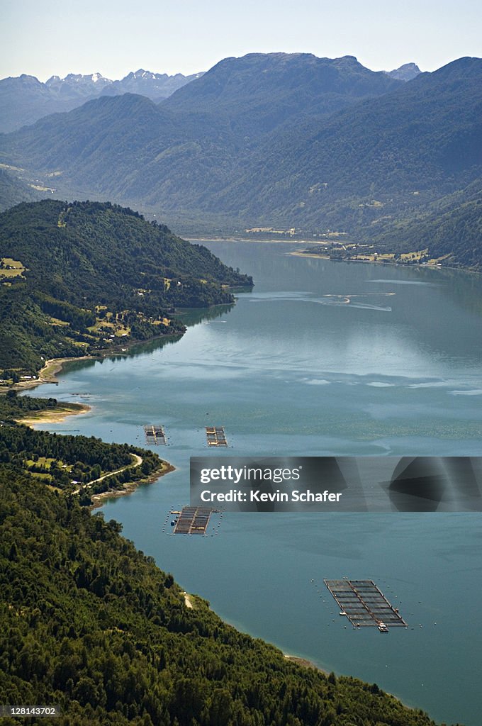 Aerial of saltwater salmon farms. Estero de Reloncavi, Puerto Montt area, Chile