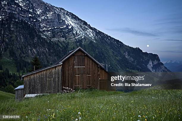moonrise over alpine hut, heidiland, swiss alps, switzerland - heidiland stock pictures, royalty-free photos & images
