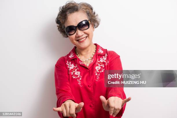 happy senior woman with sunglasses - alter ego stock-fotos und bilder