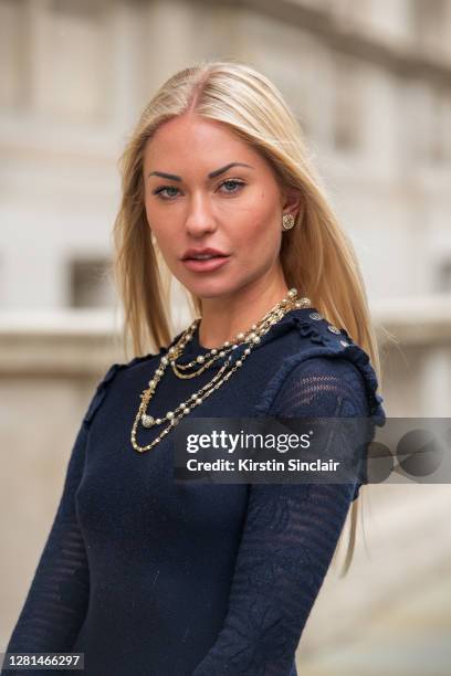 Model and Influencer Lexi Fargo wears a Chanel dress, necklace and earrings during LFW September 2020 at on September 20, 2020 in London, England.