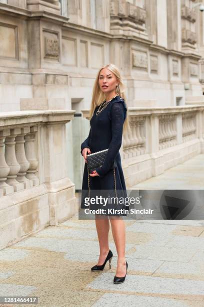 Model and Influencer Lexi Fargo wears a Chanel dress, necklace, bag, earrings and shoes during LFW September 2020 at on September 20, 2020 in London,...