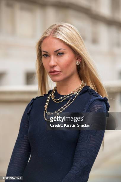 Model and Influencer Lexi Fargo wears a Chanel dress, necklace and earrings during LFW September 2020 at on September 20, 2020 in London, England.