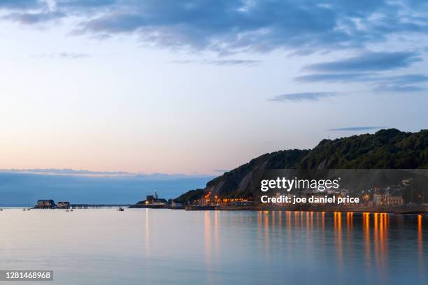 sunset, mumbles lighthouse, mumbles, swansea, wales - スワンシー ストックフォトと画像