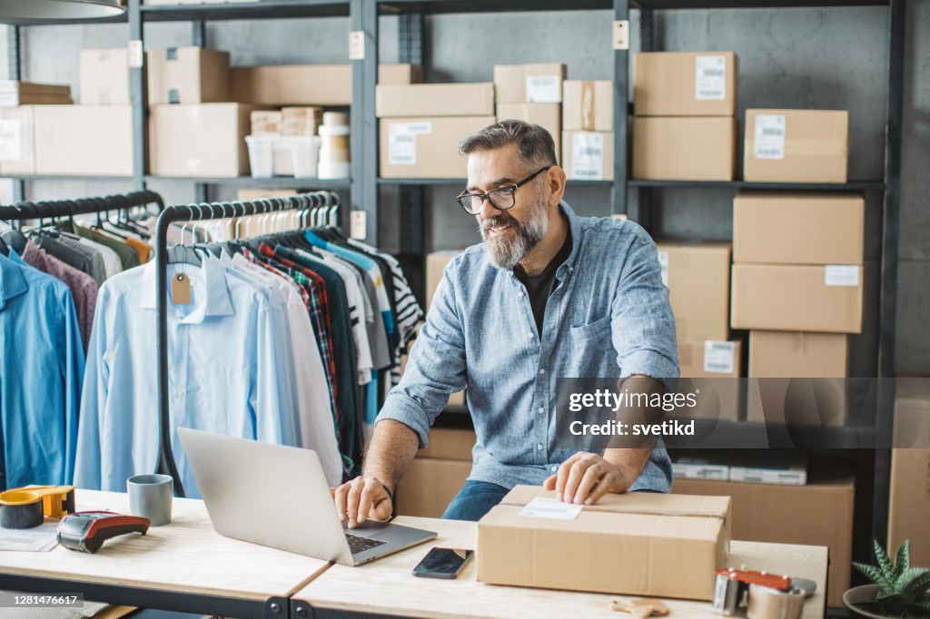 Mature man running online store
