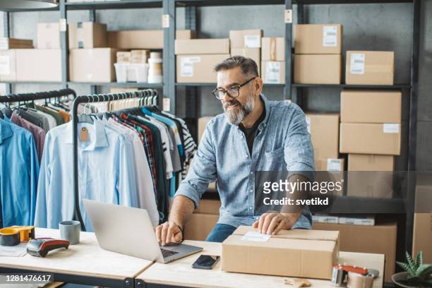 mature man running online store - entrepreneur stock pictures, royalty-free photos & images