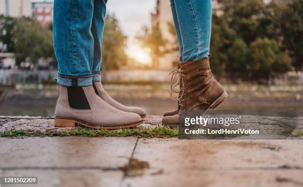 legs of a kissing couple - girlfriend feet stock pictures, royalty-free photos & images