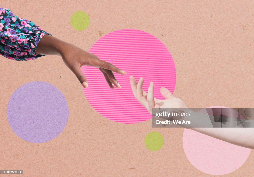 Two hands reaching for each other