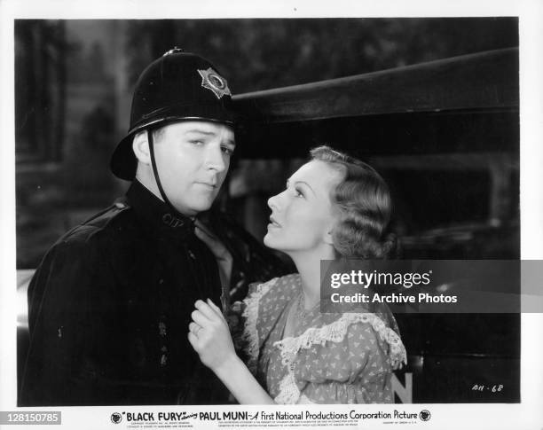 Karen Morley looking up at William Gargan in a scene from the film 'Black Fury', 1935.