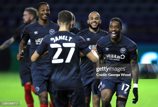 Ivan Toney of Brentford FC celebrates with teammates after scoring his sides second goal during the Sky Bet Championship match between Sheffield...