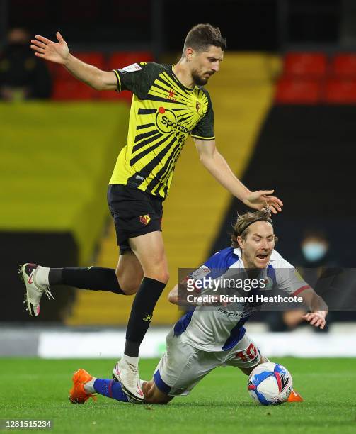 Lewis Holtby of Blackburn Rovers is fouled by Craig Cathcart of Watford during the Sky Bet Championship match between Watford and Blackburn Rovers at...