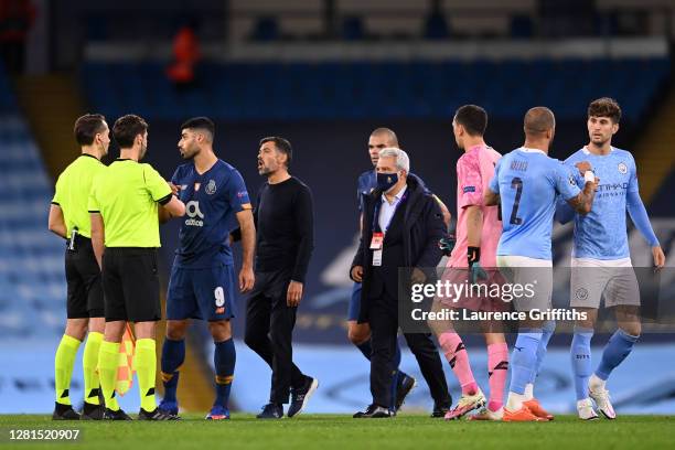 Sergio Conceicao, Manager of FC Porto confronts referee Andris Treimanis following the UEFA Champions League Group C stage match between Manchester...