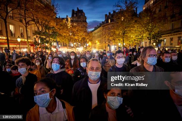 Crowds gathered at Place de la Sorbonne to watch the National Tribute to the murdered school teacher Samuel Paty lead by French President Emmanuel...