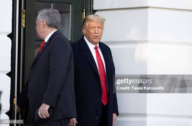 White House Chief of Staff Mark Meadows and U.S. President Donald Trump walk out of the White House on October 21, 2020 in Washington, DC. President...