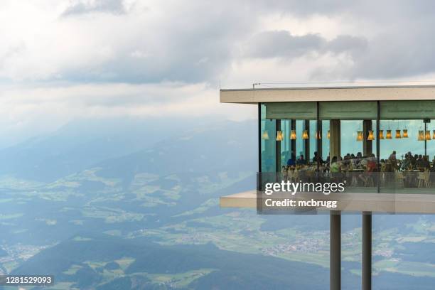 restaurant with a spectacular view in the italian alps - lumen stock pictures, royalty-free photos & images