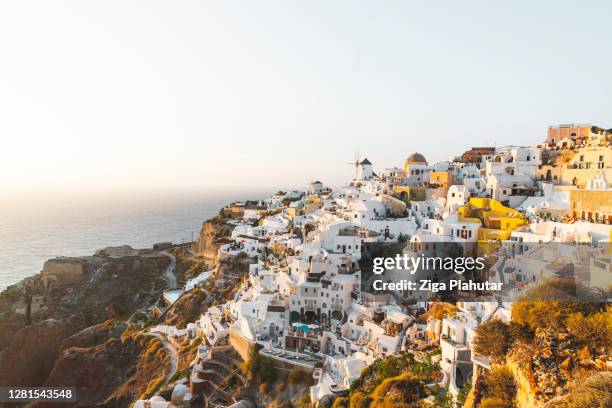 golden hour in oia, santorini - firak stock pictures, royalty-free photos & images