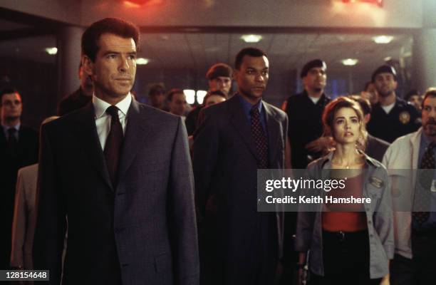 From left to right, Irish actor Pierce Brosnan as 007, English actor Colin Salmon as Charles Robinson and American actress Denise Richards as Dr...